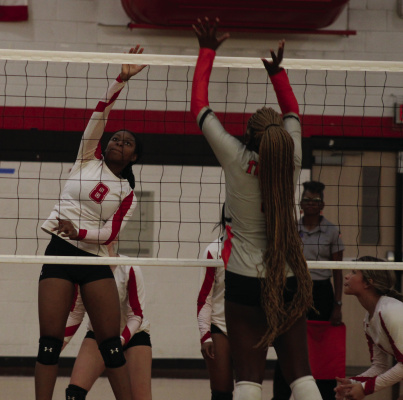 Terrell Lady Tiger Aubree Tate delivers a kill over the net against the Lancaster Lady Tigers during their district contest Sept. 29 at home. Photo by Bodey Cooper