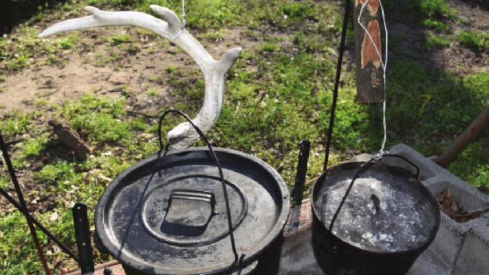 Luke’s outdoor cooking set up. Just about anything that can be cooked inside in the kitchen can be prepared over coals in a Dutch Kettle. PHOTO BY LUKE CLAYTON