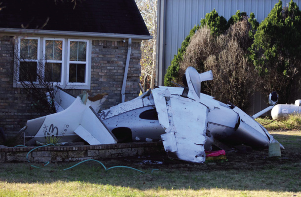 A civilian aircraft crashed in the area of Private Road 7005 in Edgewood on Dec. 26, 2003, at around 6 p.m. The plane came to rest, striking a residence at the location and causing minor damage to the home. Photo by Nick Gibbons, The County Eagle