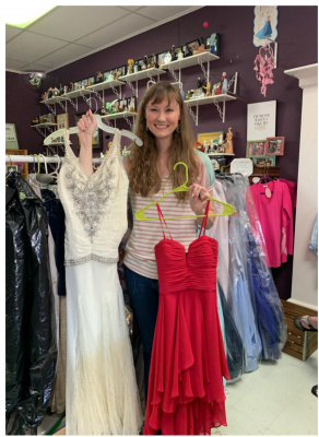 Erin Green holds up two of the dresses that were donated to this year’s King’s Fort Chapter Daughters of the American Revolution Prom Dress Drive. Courtesy photo
