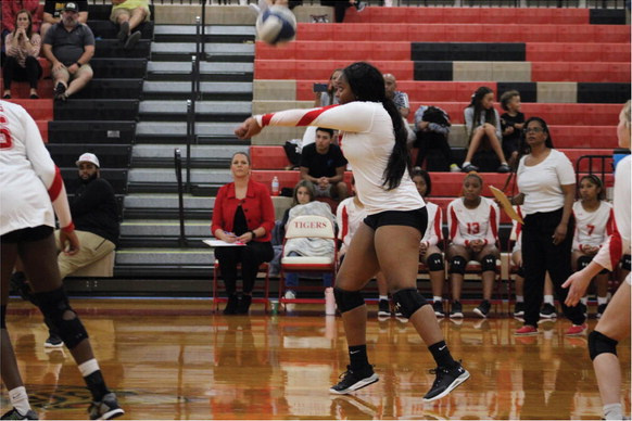 Terrell Lady Tiger Danyale Hubbard bumps the ball to a teammate during the second set of their district opener against the Crandall Lady Pirates at home Sept. 12. Photo by Bodey Cooper
