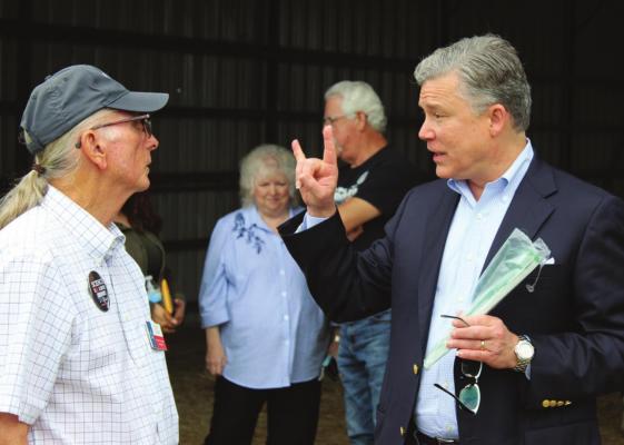 Texas Attorney General candidate Joe Jaworski, right, talks with Ron Thorn on May 22 at the Wood Farm in east Kaufman County. HANK MURPHY PHOTO