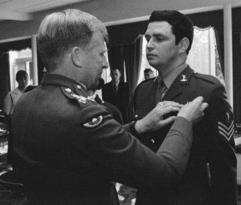 Ian Foulkes (right) receives an award from Brig. General Griffin. Photo courtesy of Patrick Hotard