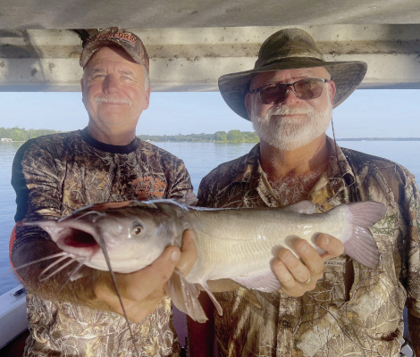 Jeff Rice and catfish guide David Hanson (Right) shows off a chunky Lake Fork Channel catfish, one of limits landed this past week while fishing in the shade of a bridge. Photo by Luke Clayton