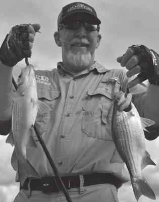 Guide Omar Cotter and Luke enjoyed some red hot white bass catching at Lake Tawakoni last week. PHOTO BY LUKE CLAYTON