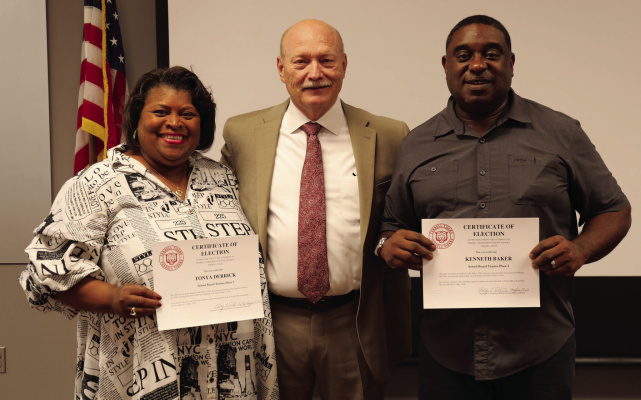 School board members Tonya Derrick (left) and Kenneth Baker (right) were sworn in to serve another term on the Terrell ISD school board during their regular meeting May 20. Photo courtesy of Terrell ISD Facebook page