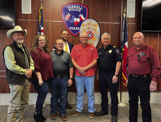 Terrell Police Officer Nathan Hauger (third from left), a 28-year veteran, announced his retirement with his final day coming Oct. 27. A private ceremony was held for Nate at Terrell PD Headquarters Nov. 3 as he was joined by family, friends and department members. Photo courtesy of Terrell Police Department Facebook page