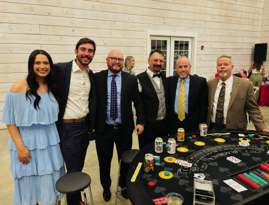 Employees of Nav Central/Emergency Jets in Forney enjoyed the Blackjack tables and festivities at REACH Casino night. Additional photos on 3A. Photo by Mary Dlabaj