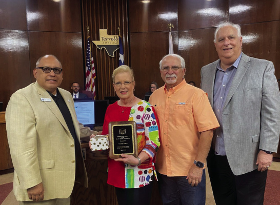 The Terrell Chamber of Commerce and the Terrell City Council recognized Cindy Tayem, recently retired Area Manager for Oncor, at the May 2 Council meeting. Chamber of Commerce President Carlton Tidwell presented her with a plaque naming her as an Honorary Life Member of the Chamber. Mayor Rick Carmona presented her with a bouquet and cookies in recognition for her 45 years of service to the community. Pictured with her is her husband Alex. Courtesy photo