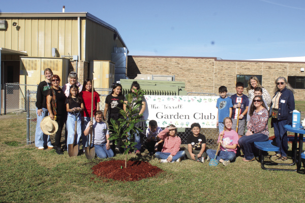 The Terrell Garden Club partnered up with students at Kaufman ISD to plant six trees at Phillips Elementary School to celebrate Arbor Day on Tuesday, Nov. 4. Members of the Terrell Garden Club, along with elementary school students and staff, planted two Magnolia trees, two Vitex trees and two Bamboo trees. Photo by Bodey Cooper