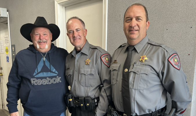 John Sutton, left, stopped by the Kaufman County Commissioners Court meeting Oct. 18 to show his appreciation to Precinct 3 Deputy Constable Wade Bowden, center, during a recent family tragedy. Joining the pair for a picture was Precinct 3 Constable Matt Woodall. Courtesy photo