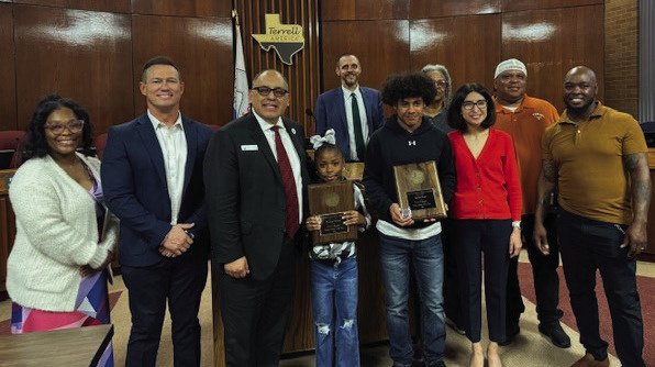 The North Texas Longhorns Summer Track Club Athletes of the Year were recognized during the Terrell City Council meeting on March 4. Jayden Scott (14 and under) was named Male Athlete of the Year. D’Zhani Devine (8 and under) was named Female Athlete of the Year. Pictured with the athletes are their family members, Coach Keith Willis and members of the Terrell City Council during their regular meeting March 4. Photo courtesy of City of Terrell Facebook page
