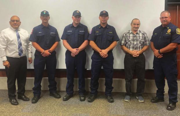Terrell Fire Department Engine 611 first responders are credited with saving the life of local resident Andrew Truett on July 4. Terrell City Council honored the crew during a recent Council meeting. Pictured are (from left) Mayor Rick Carmona, Firefighter/ Paramedics Tanner Smith and Josh MacKenzie, Captain Michael Angell, Andrew Truett and TFD Chief Shane LeCroy. COURTESY PHOTO