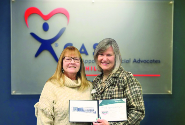 Chris Hoffmeyer (left) is presented with the Hometown Hero Award by Diane Stegall (right). Courtesy photo