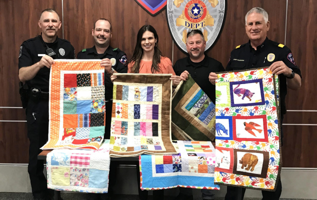 A Terrell quilter that wished to remain anonymous donated comfort quilts to the Terrell Police Department for use in critical situations involving children. Pictured accepting the donation are, left to right, Robert Gentry, Luke Brewer, Jennifer Aldridge, Dock Ballard and Chief Kenneth McKeown. Courtesy photo
