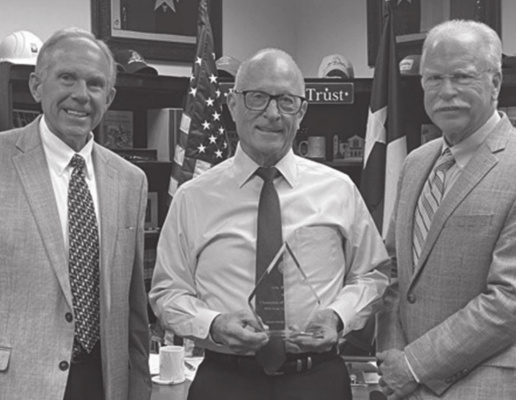 Sen. Bob Hall accepts the Champion of Transparency Award from Donnis Baggett and Mike Hodges of Texas Press Association. COURTESY PHOTO