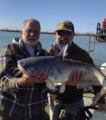 Donny Rice shows off one of many blue catfish caught recently on noodles (jug lines) while fishing in Donny’s lake. Photo by Luke Clayton