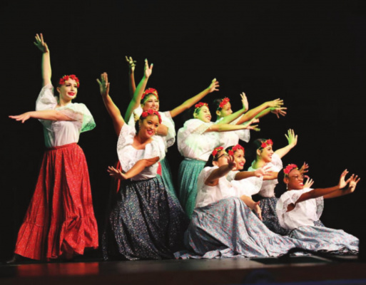 Dancers in colorful garb entertain Terrell students at the Jamie Foxx Performing Arts Center last week during a special program to celebrate Hispanic heritage. PHOTOS COURTESY OF TERRELL ISD