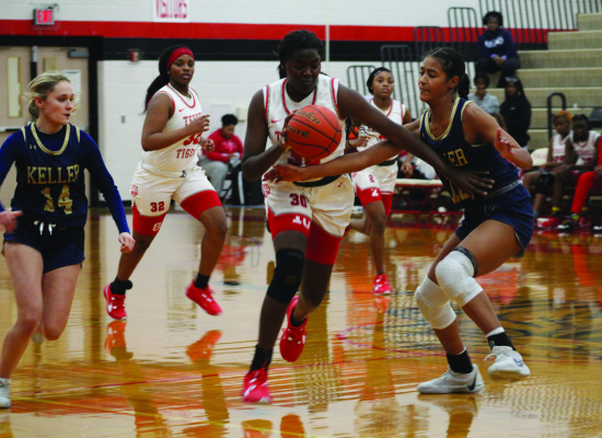 Terrell Lady Tiger Serenity McCullough battles through contact during the second quarter of their home game against the Keller Indians Dec. 5. Photo by Bodey Cooper