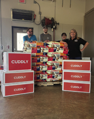 CUDDLY donated 2,000 lbs. of dog food to the Kaufman County shelter for dogs as they look for their forever homes. Courtesy photo