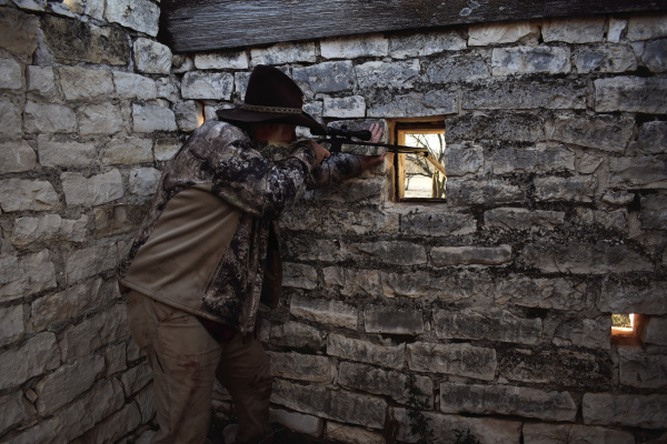 A deer stand can be anything from a board nailed in a tree to an old stone structure with shooting ports. Larry Weishuhn is hunting from an old long abandoned Calvary outpost in West Texas. Photo by Luke Clayton