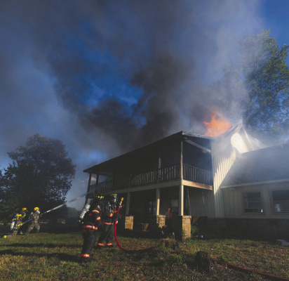 Able Springs Volunteer Fire Department, along with multiple agencies, battled a two-story house fire on Monday, Sept. 14 at 32150 FM 429. Photos courtesy of College Mound FD