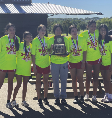 The Terrell Tigers varsity girls’ cross country team is headed to the Regional meet after taking second overall at the District meet in Crandall Oct. 9. Photo courtesy of Joe Stephens