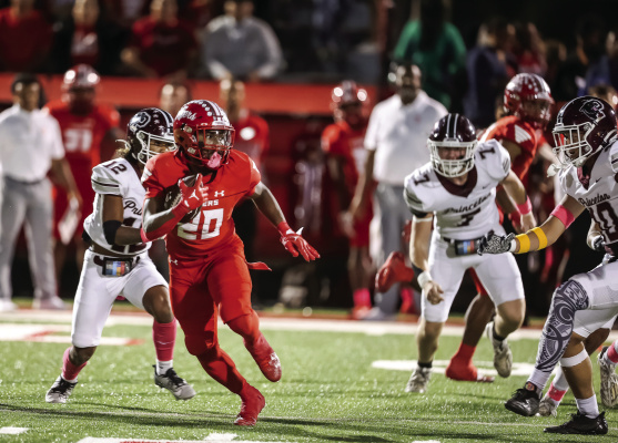 Photo courtesy of Oladipo Awowale/The Princeton Herald Terrell Tigers running back Chase Bingmon escapes Princeton Panthers defenders Oct. 13 at Terrell’s homecoming contest. Bingmon’s four-touchdown performance carries the Tigers to a 42-8 victory.