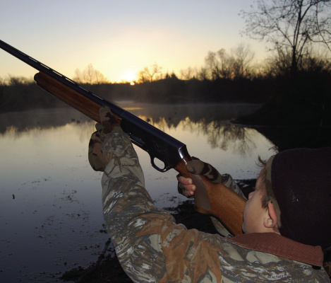 Hunting ducks is a great way to introduce youngsters to the outdoor lifestyle. Safety first, always! The youngster can set in front in the blind where he can best be instructed. Photo by Luke Clayton