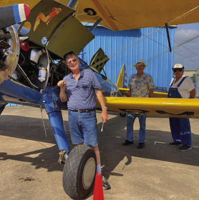 Pilot Carl Best does a quick check of Old 42 prior to a recent flight. Photo courtesy of No. 1 BFTS Museum