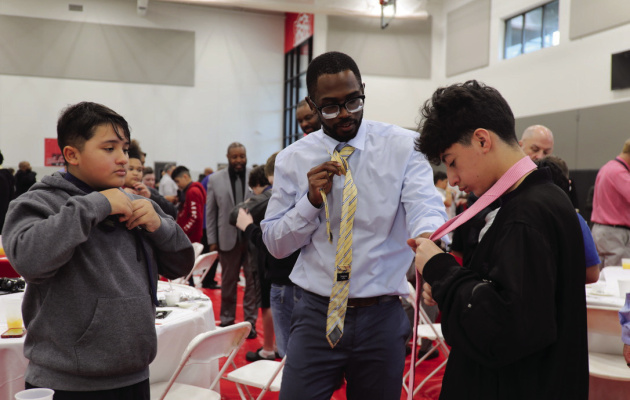 Terrell ISD is hosting their annual Boys to Men Breakfast on Thursday, March 6 at the Terrell ExCEL Center. Men from the Terrell community will teach sixth-grade students how to tie a tie, as pictured from last year’s breakfast. Photo courtesy of Terrell ISD Facebook page
