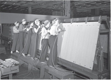 The riveters (note, all women) working on a B-24 wing. Photo courtesy of No. 1 BFTS Museum