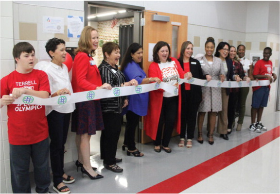 Terrell ISD Superintendent Dr. Georgeanne Warnock officially cuts the ribbon for the Tiger Mart opening as part of the THRIVE Program provided by Texas Health Resources Sept. 14. Additional photos on 2A. Photo by Bodey Cooper