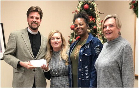 The Good Shepherd Episcopal Church recently made a donation to the Lakes Regional Community Center. The donation will go towards providing clients of the Lakes Regional Community Center and their families Thanksgiving dinners. Courtesy photo