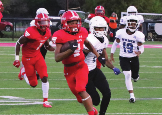 Junior running back Chase Frazier breaks free for a 65-yard touchdown during the first quarter of Terrell’s 40-13 win over Wilmer-Hutchins. PHOTOS BY DAVID KAPITAN