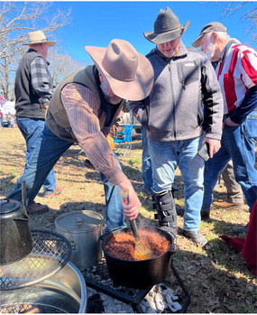 Events designed to celebrate the outdoor life style are always well received. Here a chuck wagon cook is serving some tasty food prepared right over the campfire embers at an event in Greenville earlier this year. Photo by Luke Clayton