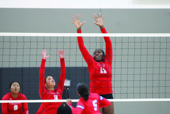Terrell Lady Tigers Kaitlyn Chumley (#3) and Serenity McCullough (#11) go up to block a kill during tournament play against the South Garland Lady Titans Friday, Aug. 23 at the ExCEL Center. Photos by Bodey Cooper