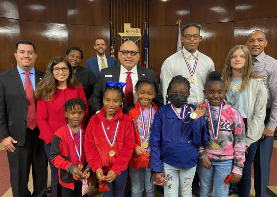 City of Terrell Mayor Rick Carmona (center), joined by (from left) Mayor Pro Tem Tim Royse, Deputy Mayor Pro Tem Mayrani Velazquez, Council member Stephanie Holmes-Thomas, City Manager Mike Sims and Council member Grady Simpson (right) recognized Terrell Prime Track Club members for their 2021 accomplishments during their Dec. 7 City Council meeting. Courtesy photo