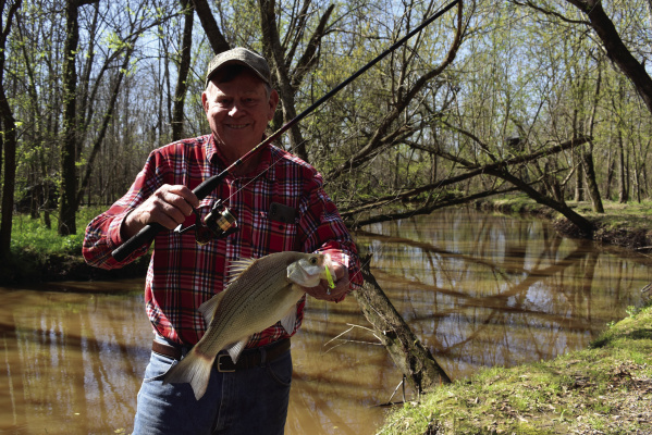 White bass (sand bass) are fun to catch and great eating. Here’s Luke with a ‘bigun’ that landed during the early spring spawn. Catching is fast and furious now on many area lakes. Photo by Jeff Rice