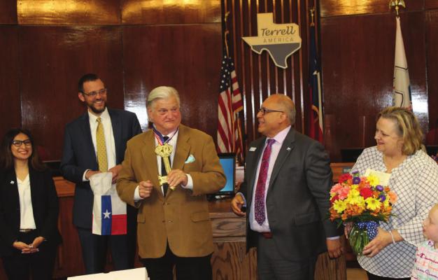 Outgoing Councilman Charles Whitaker shares a light-hearted moment with Mayor Rick Carmona who presented him with a symbolic key to the city Tuesday evening. From left are Councilwoman Mayrani Velazquez, City Manager Mike Sims, Whitaker, Carmona, Whitaker’s wife Sarah and his granddaughter Carolyn. HANK MURPHY PHOTO