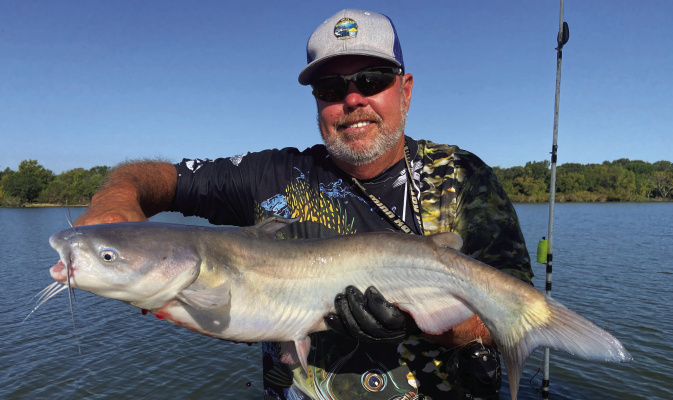 Lake Tawakoni guide Tony Pennebaker shows off one of many blue catfish he landed on a trip last week. The ‘big fish’ fall bite is getting underway. Photo by Luke Clayton