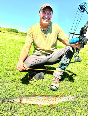 Luke’s friend, Kenneth Shephard, with a good ‘eater size’ gar. Photo by Luke Clayton