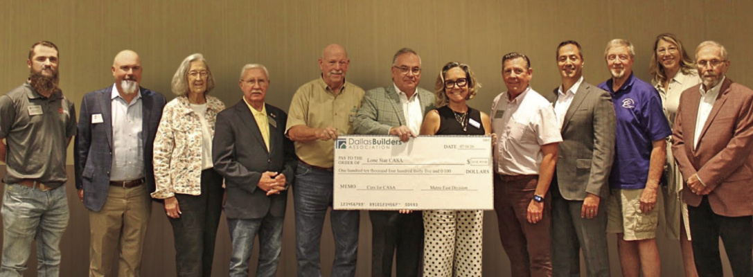 The Metro East Division of the Dallas Builders Association presents a $110,435 check to Lone Star CASA. Courtesy Photo