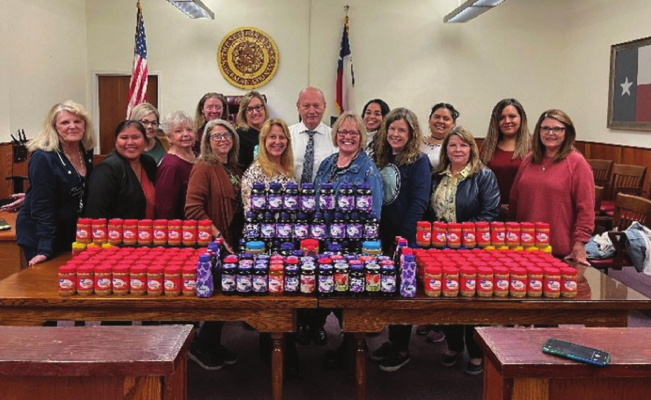 The Kaufman Downtown Merchants’ annual “Peanut Butter and Jolly” food drive received a helping hand from both the Kaufman County Clerk’s Office and Kaufman County Court at Law 2 Office with a donation of 200 jars of peanut butter and jelly. courTeSY phoTo