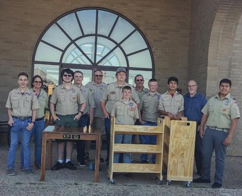 Members of Boy Scout Troop 332. Two members of the troop, Julian Castanda and Jonathan Oblad, donated wooden engraved book carts and a chess table, which were produced through their Eagle Scout projects. COURTESY PHOTO
