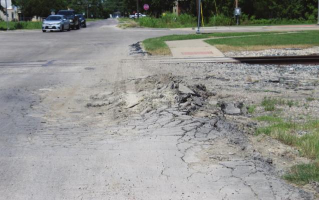 One example of significant pavement damage on Temple Street, which is heavily used by large trucks. The city intends to rebuild Temple with concrete and attempt to route truck traffic away from the Stallings Addition. HANK MURPHY PHOTO