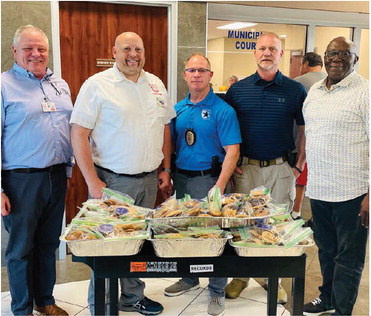 Rotary of Terrell Past President Stan Heisel, President Greg Garrow, Captain Michael Bulin, Lieutenant Jason Tidwell and President Elect Darrell Coleman delivered cookies at the finish of the service project meeting. Photo courtesy of Mary Dlabaj