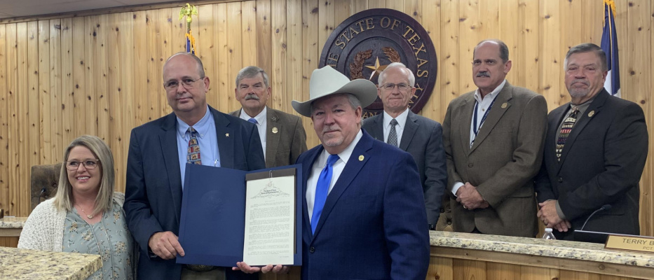 State Representative Keith Bell presented a Resolution honoring Jimmy Beavers, Kaufman County Sheriff Bryan Beaver’s father, during the Nov. 30 commissioners court meeting. Those present for the occasion included (back row, l-r) Commissioner Skeet Phillips, County Judge Hal Richards, Commissioner Terry Barber, Commissioner Ken Cates, (front row, l-r): Monica Beavers, Sheriff Bryan Beavers and State Representative Keith Bell. Courtesy photo