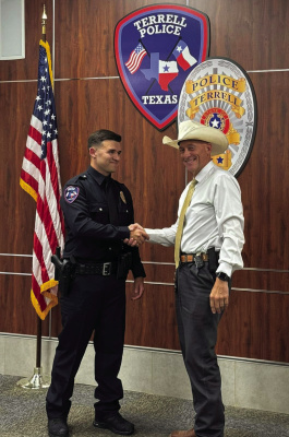 Interim Terrell Police Chief Arley Sansom welcomes Officer Jacob Candanoza (right) during his swearing in ceremony Monday, July 15. Photo courtesy of Terrell Police Department