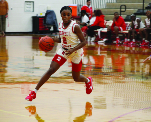 The Terrell Lady Tigers picked up their second win of the season with a 45-38 defeat of the North Mesquite Stallions Nov. 18 at Forney High School during tournament play. Photo by Bodey Cooper